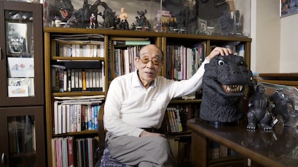 Haruo Nakajima next to the head he has worn in a dozen films.