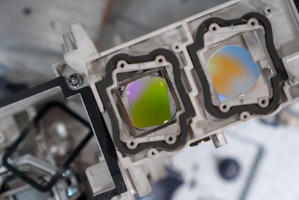 Two laser modules actually shine through the lens.