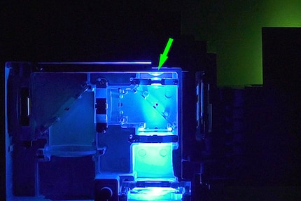 The G-Refiner lens sits inside the housing itself and converts blue light into green light before it is reflected back to the mirror.blue light into green light before it is reflected by the mirror to the right towards the lens