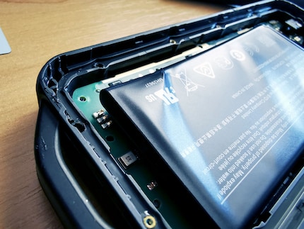 The battery is bent and needs to be replaced.