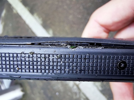 After kicking it a few times, the back bezel is slightly bent.