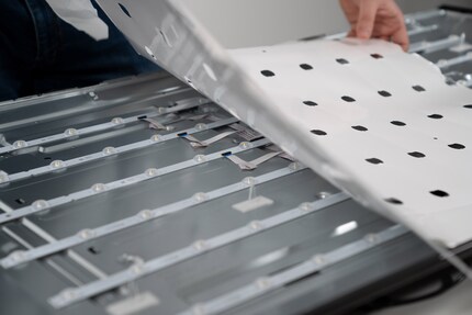 The LED strips are tucked away behind the white protective foil.