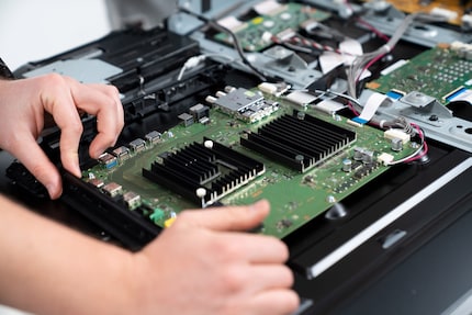 Two black, corrugated heat sinks stop the processors from overheating.