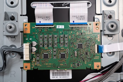 The information for the mainboard comes in from the right side. The flat ribbon cables send the information up to the LEDs.