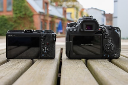 The EOS D90 (right) has more buttons on the back.