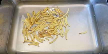 I wash the potato sticks after cutting them.