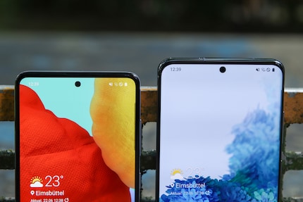 The front camera is in the centre of both displays.