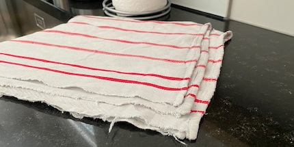 Used dishcloths are a great alternative to kitchen paper.
