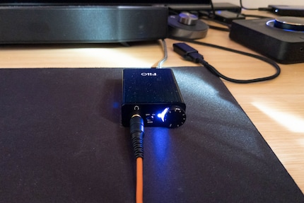 The Fiio E10k is an affordable and reliable DAC amp.