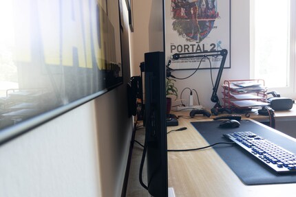 A wall mount provides distance and more space on the desk.