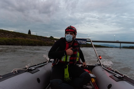 Kevin Berger navigates the lifeboat through the current.