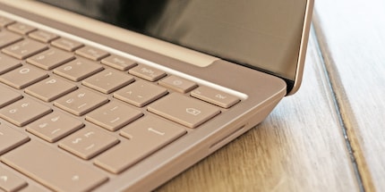 No Windows Hello camera, but a fingerprint sensor in the power button.