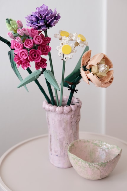 Opaque vases make the flowers look more authentic. They hide the somewhat angular stems.