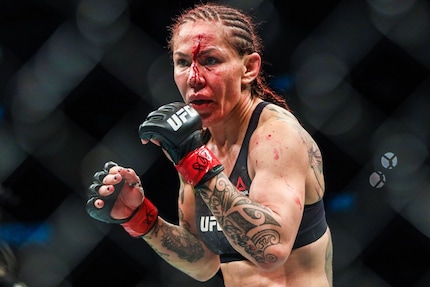 Cris Cyborg during her normal working day. Would NeuralHash sound the alarm here?