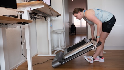 The power cable gets in the way and has to be unplugged so Anne can store the WalkingPad upright.