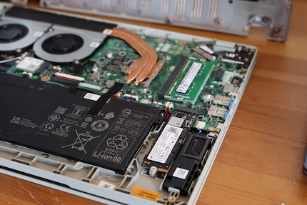 The SSD is secured with a screw, while the RAM is simply slotted in.