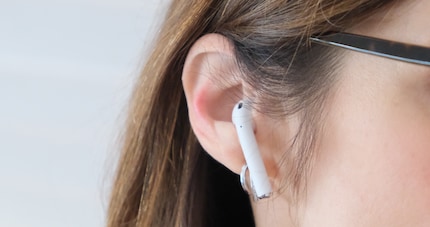 The AirPods in use, shown in my wife’s prettier ears.