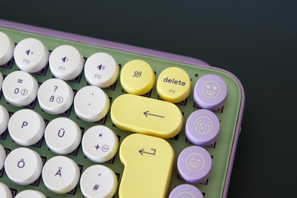The dictation function is located between the Delete and the Backspace keys.