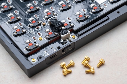 The sister board for the Q1 is connected to the main board with a cable.