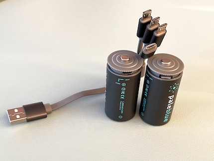 These thick things have micro-USB-C and USB-C ports on opposite sides. Both are elegantly exposed by turning the battery cap.