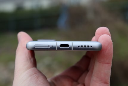 SIM card slot, USB-C port and the bottom speaker.