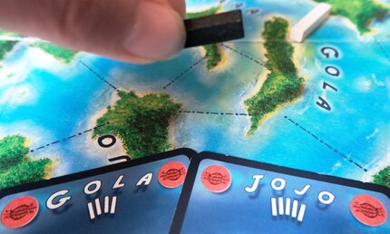If you play both cards of connected islands, the existing bridge is destroyed.