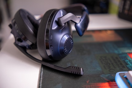 You can adjust the volume via the dial on the right ear cup.