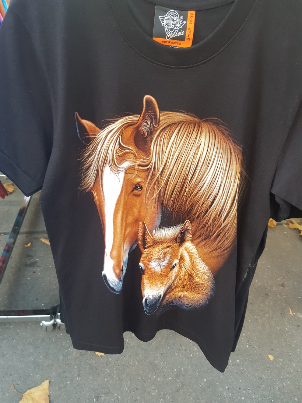 Or on this kind of laid-back T-shirt with a horse logo.
