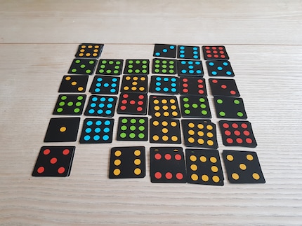 If we’d both had four in a row, you’d count the points and the one with fewer points in their row would win. It’s just stupid that in my example, both rows have the same number of points. What would happen then isn’t written in the game instructions. I think the one with more rows of three wins.