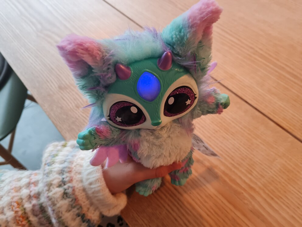 Mixie is finally freed and making happy sounds. When the wand touches its forehead, the crystal glows in different colours.