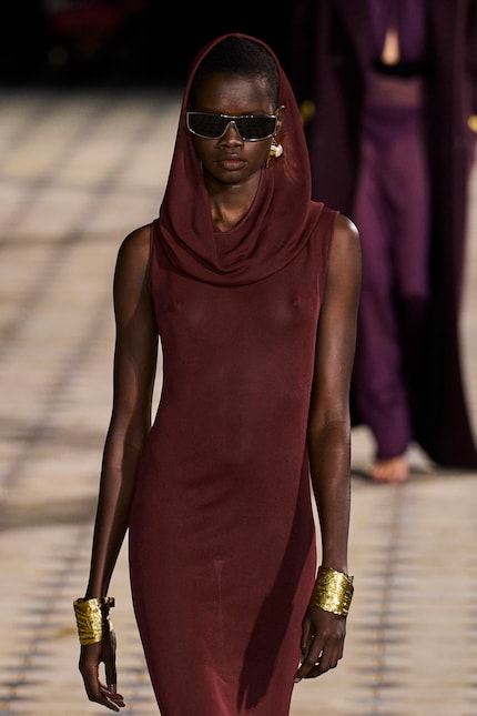 Two wide gold bangles like Saint Laurent's look beautifully classic.