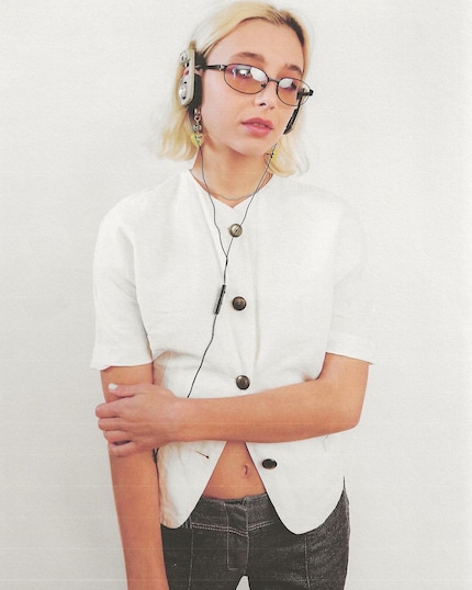 Fashion girl Emma Chamberlain with the ultra-popular Porta Pros from Koss.