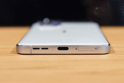 The phone charges via a USB-C.