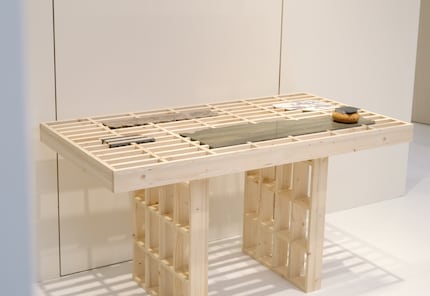 The wooden structure of the Remnant Table is perfectly matched to each broken piece of marble.
