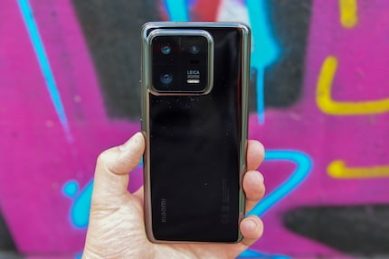 At the right angle, there are no reflections and the back is also black in the photo.
