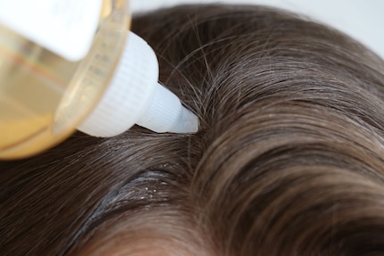 The glycolic acid toner from The Ordinary is easy to spread on your scalp.