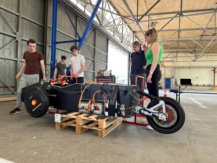 Team meeting in the hangar.
