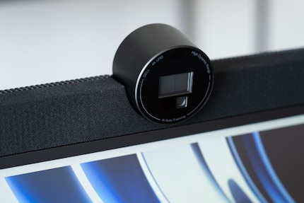 The fabric-covered speakers with an embedded webcam catch the eye