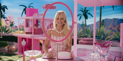 Margot Robbie as one of many Barbies must venture into the real world to save herself and Barbie Land.