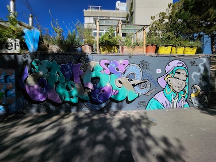 The wall of graffiti in wide angle.