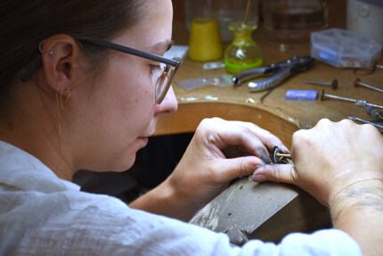 Anja Bänninger working on the setting in which the memorial stone is placed.