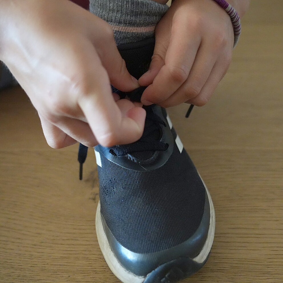 ... and tie them together with a knot. Your shoes are ready to go!