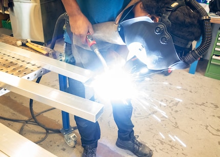 Moshe Hinojosa welding an aluminium blank.