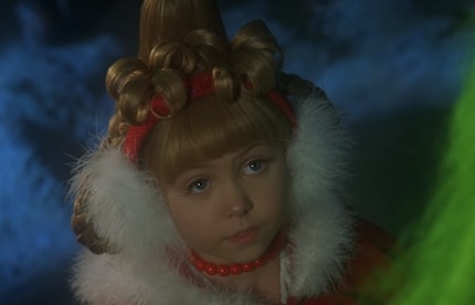 Cindy Lou Who (played by Taylor Momsen) from The Grinch impressively demonstrates how well earmuffs and hairstyles go together.