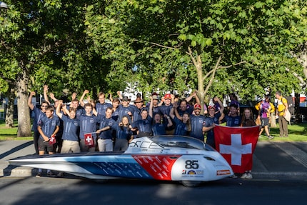 Group photo with solar racing car.