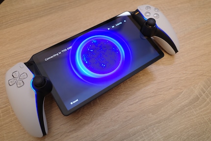 A round portal opens on the screen when I connect, giving me access to my PS5 content.