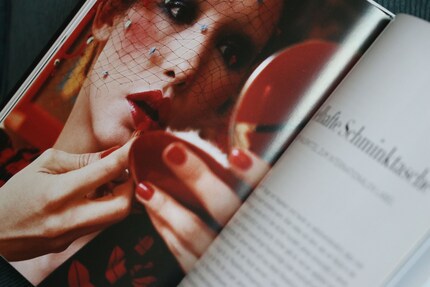 Regularly checking your lipstick in the mirror is a must, as red lipsticks tend to develop a life of their own. Image from the book «Face Paint» by Lisa Eldridge.