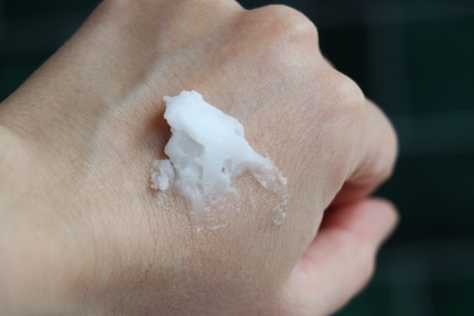 The consistency is firm until you massage it into your skin.