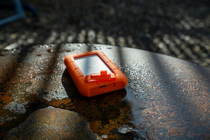 The rubber casing also protects the USB port through the cap. However, you should not submerge the device under water.