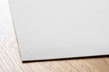 A clear, but authentically random texture – I like Hahnemühle Museum Etching.